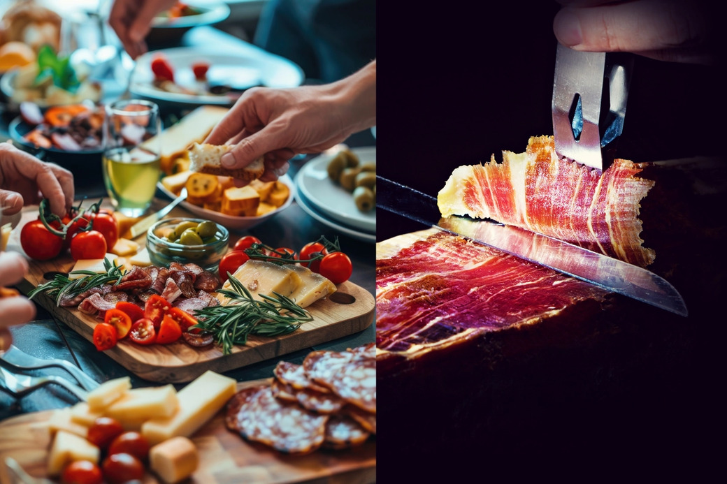Sällskap njuter av ett dignande bord uppdukat med medelhavsmat med utvald lufttorkad chark, ost och oliver. 